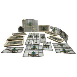 1930s external door with stained leaded glass panel (86cm x 203cm), six small stained glass windows in wooden frames (W52cm); and various loose stained leaded glass panels