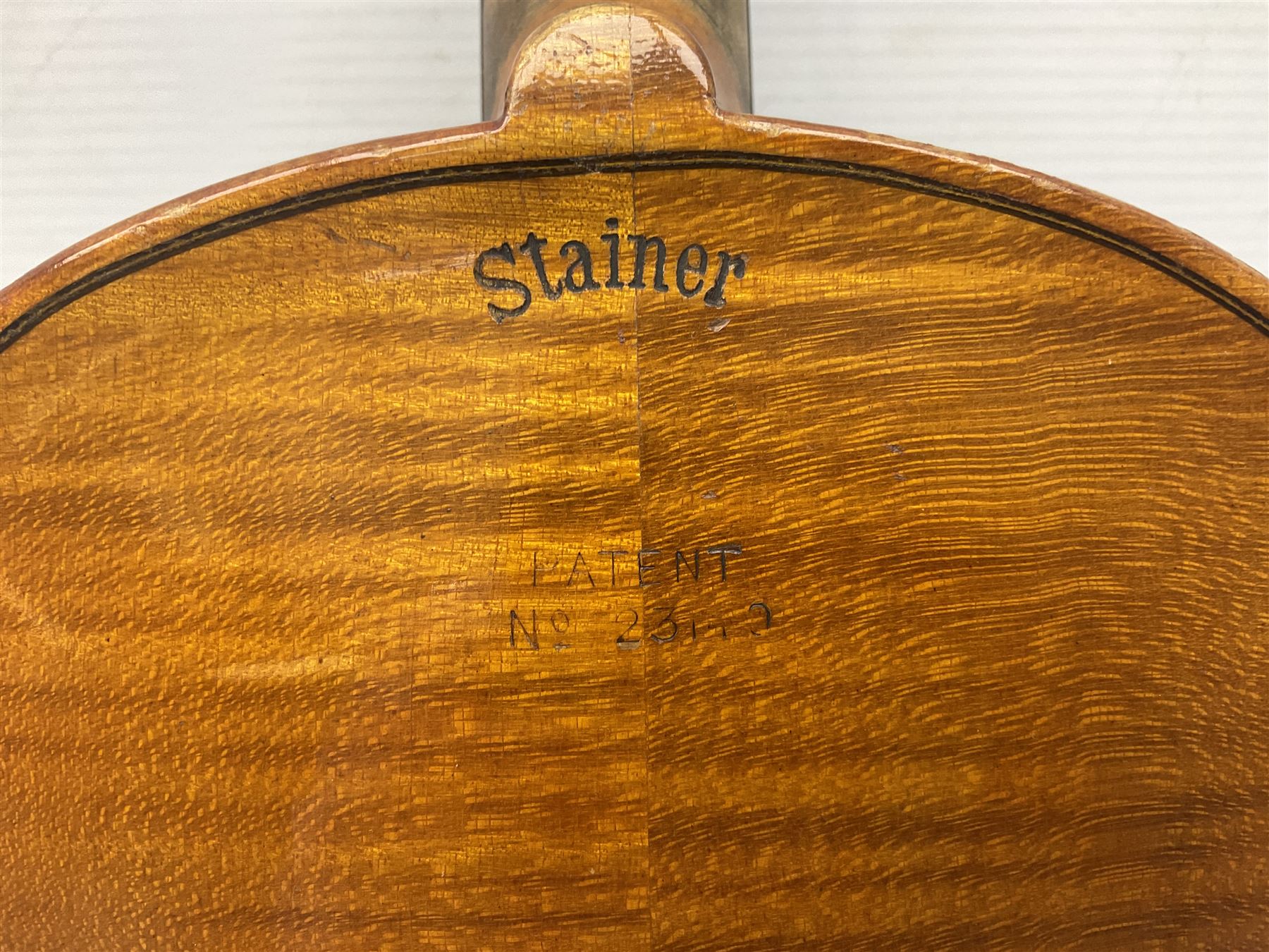 German violin c1900 stamped Stainer with 36cm two-piece maple back and ribs and spruce top L59.5cm overall; in simulated reptile skin carrying case