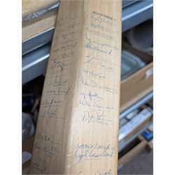Two signed cricket bats, with signatures including Colin Cowdrey