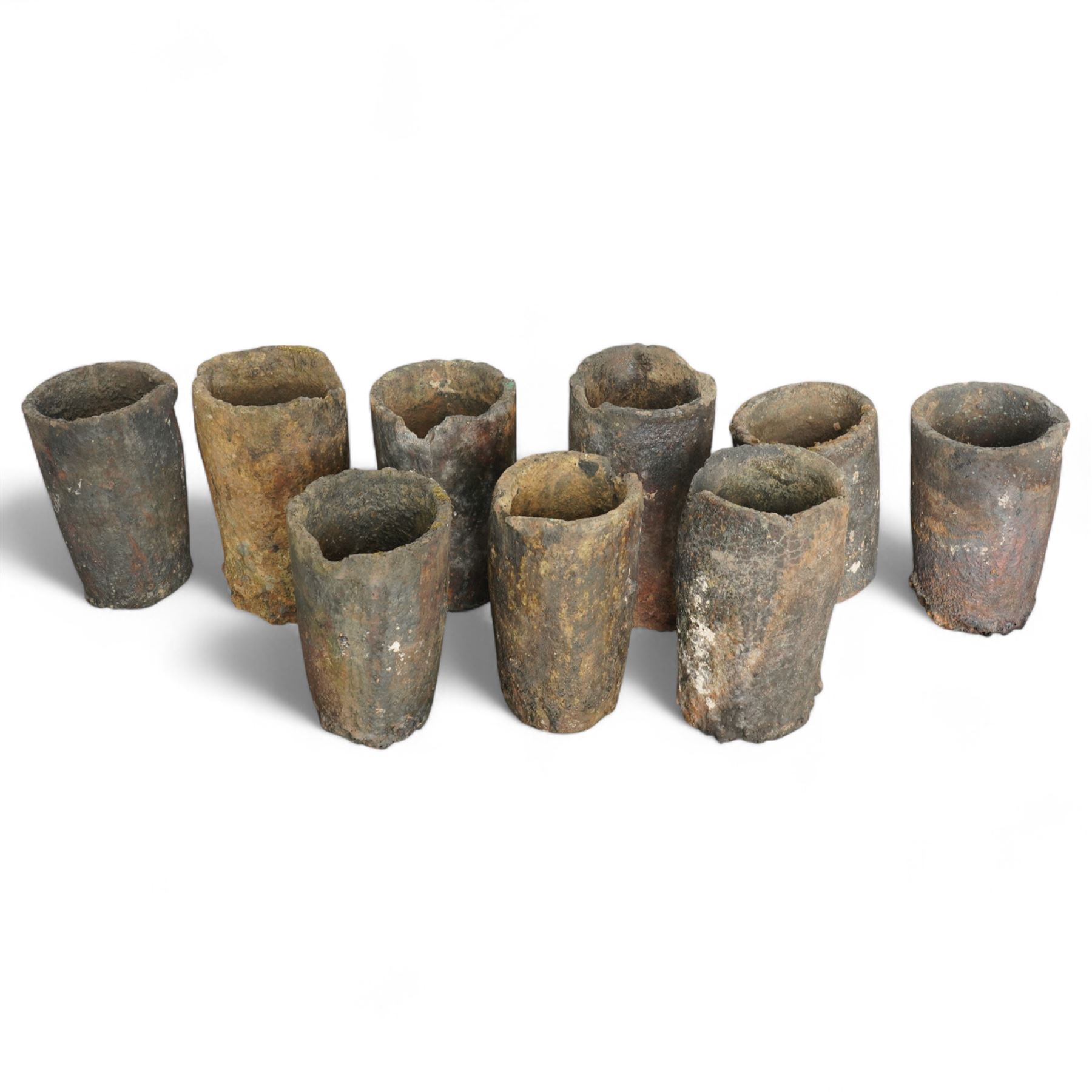 Nine lava stone iron smelting crucible pots in various conditions