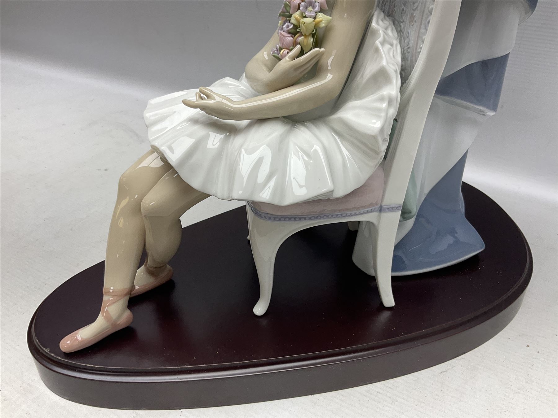 Lladro figure, Jester Serenade, modelled as a ballerina with bouquet of flowers seated before a jester playing the violin, limited edition 2541/3000, sculpted by Antonio Ramos, no 5932, with original box, year issued 1993, year retired 1994, H37cm