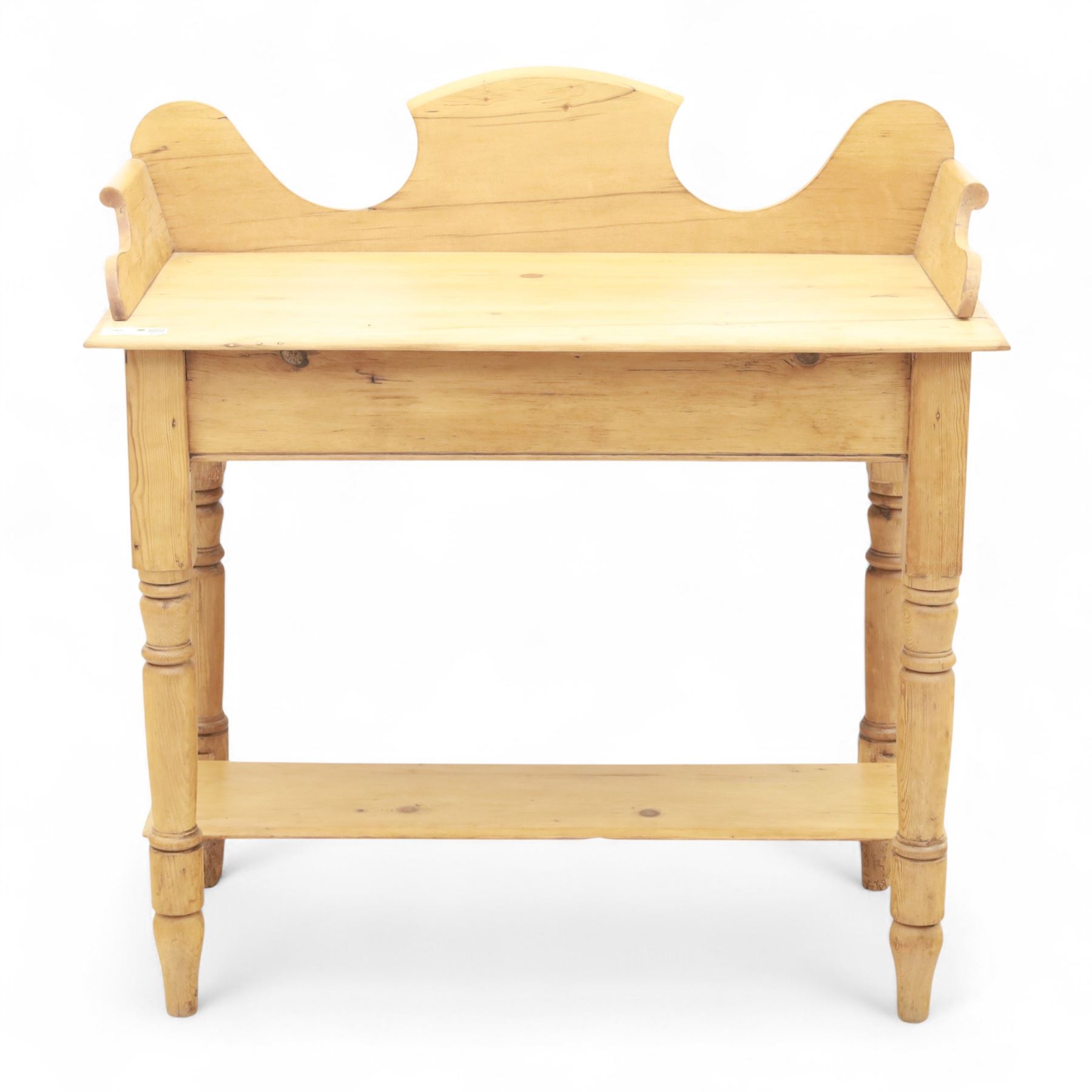 20th century pine washstand, shaped three-quarter gallery back over rectangular top, raised on turned supports with lower undertier