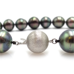  Tahitian graduating pearl necklace, with white gold clasp stamped 14K and matching pair of pendant earrings   