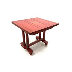 Early 20th century Chinese style red painted drawer leaf table, four turned supports joined by stretchers on ball feet