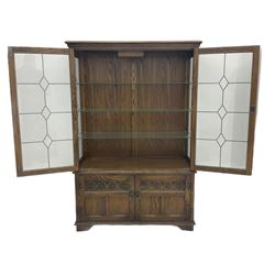 Old Charm oak glazed bookcase, fitted with two leaded doors and two cupboards