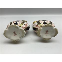 Pair of mid 20th century Royal Crown Derby Imari 1128 pattern Kedleston ewers, each with gilt scroll handle and neck, upon a gilt quatrefoil foot, each with printed marks beneath, H25.5cm