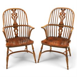 Pair of high back Windsor armchairs, fleur de lis back splat, dished seat, caroline stretcher