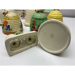 Clarice Cliff for Wilkinson Ltd Crocus Bizarre beehive honeypot painted in the Crocus pattern, together with two beehive Beswick honey pots, Poole square honey pot etc (14)