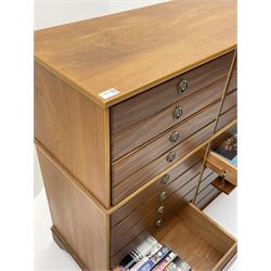 Teak multi-drawer music chest, fitted with eight drawers and four manuscript drawers with fall fronts, with contents