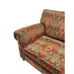 Duresta - 'Beaminster' grande two-seat sofa, traditional shape with rolled arms, upholstered in 'Althorp' russet and stone floral pattern fabric, on turned feet with brass castors
