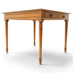 Georgian design honey-oak breakfast table of square form, the moulded edge fitted with two cock-beaded drawers, raised on turned and tapering supports