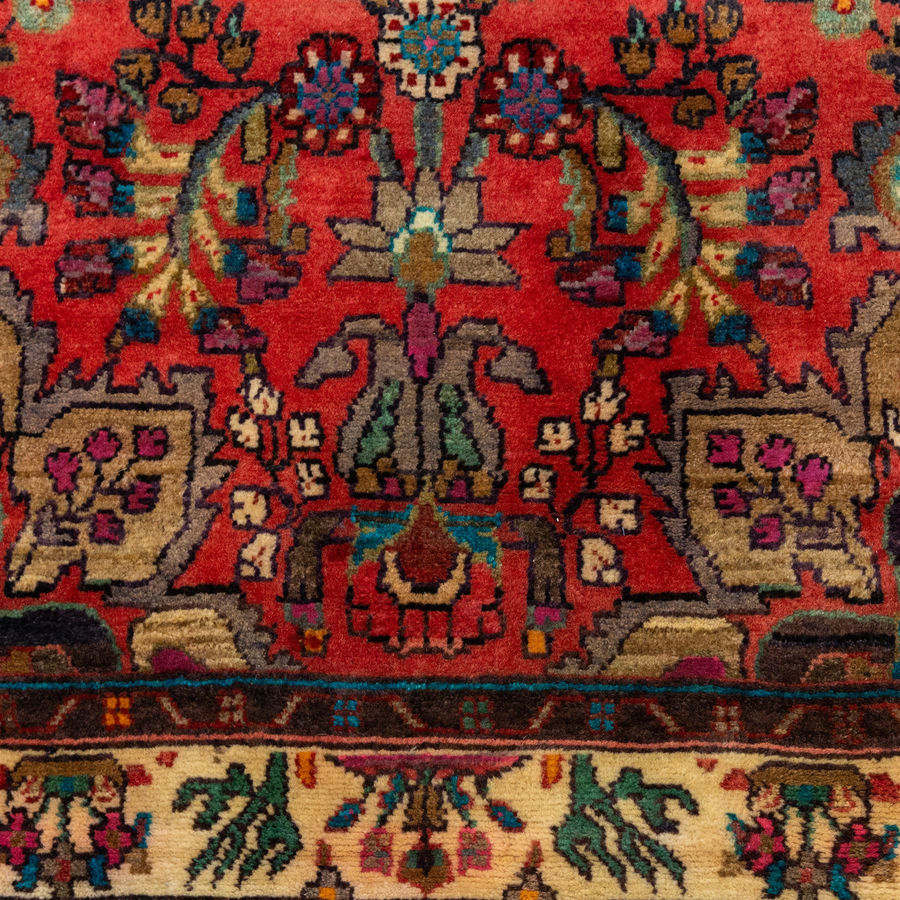North West Persian Mahal hand-knotted runner, deep red ground, with a vertical arrangement of angular floral and geometric motifs, enclosed by an ivory border  of stylized leaves and rosettes, with guard stripes on indigo ground, cotton fringe ends 