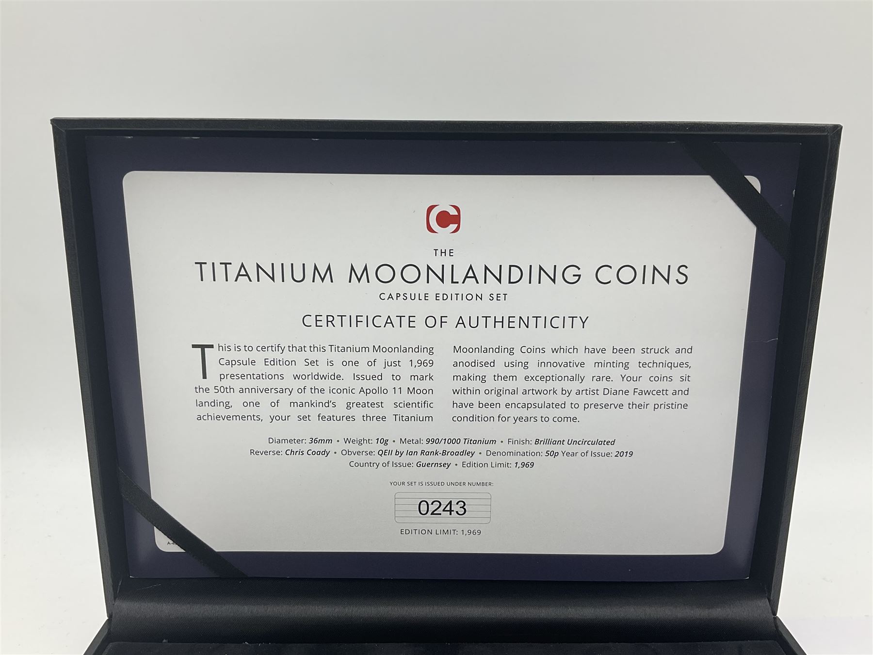 Queen Elizabeth II Bailiwick of Guernsey 2019 'The Titanium Moonlanding' fifty pence three coin set, comprising 'Green', 'Orange' and 'Blue' titanium coins, in capsules and case with certificate