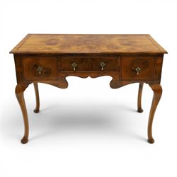 Queen Anne Design walnut kneehole desk with matching chair, rectangular figured top with crossbanding, three frieze drawers, raised on cabriole supports, the chair with serpentine front raised on cabriole supports