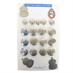 Two WWII A.R.P. silver lapel badges, hallmarked, together with a collection of other ARP buttons