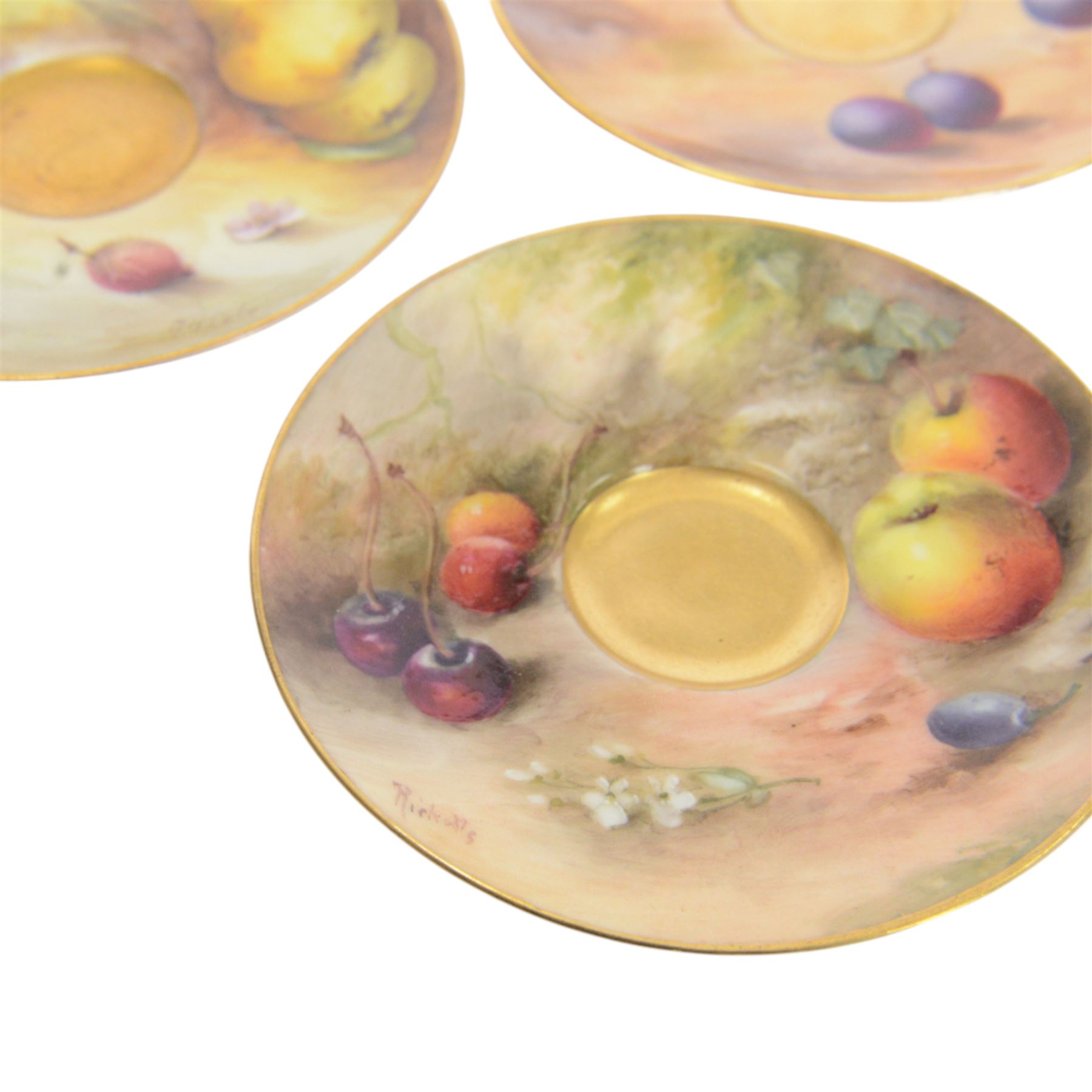 Two small 20th century Royal Worcester cabinet cups and saucers, together with another saucer, each painted with a still life of fruit upon a mossy ground, bearing various signatures: E Townsend, Ricketts, G H Cole, and H Ayrton, each with puce printed mark beneath, teacups approximately H3cm D5.5cm, coffee cup H4.5cm, saucers 9.5.cm