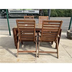 Rectangular teak drop leaf garden table, and four slatted armchairs