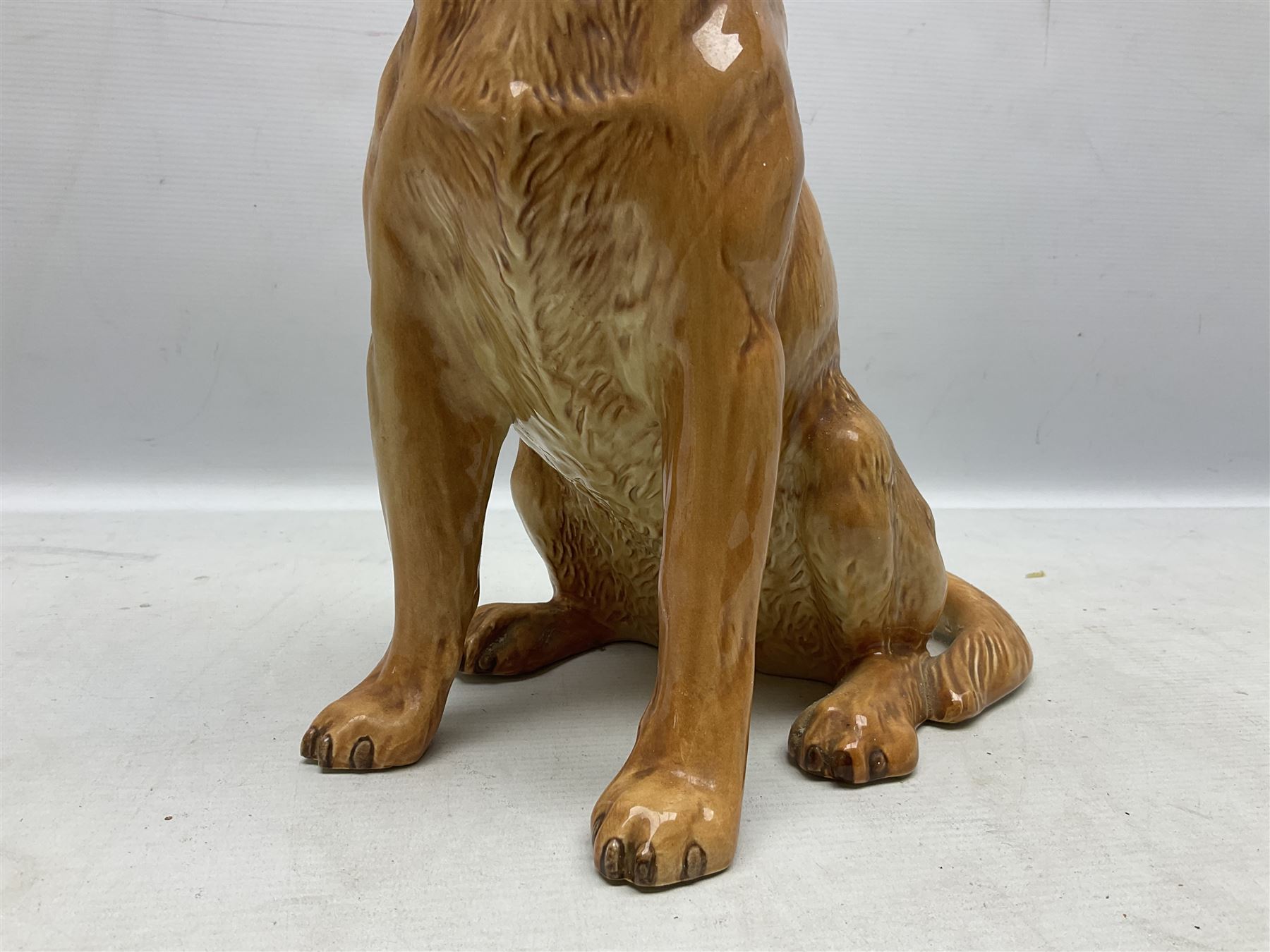 Large Beswick fire side figure of a yellow labrador, modelled seated, no. 2314, with impressed marks beneath, H34cm
