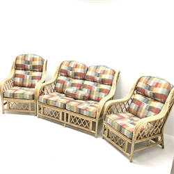 Two seat bamboo framed conservatory sofa, upholstered in a multicoloured patterned fabric (W132cm) and two matching armchairs (W74cm)