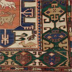 Caucasian Soumak flatweave rug, ivory field with a bold central geometric medallion framed by stylized animal motifs and angular tribal devices, one end of fringe cut, 88x70cm 