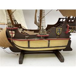 Wooden model of a schooner together with another similar example, largest example 48cm