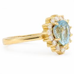 18ct gold aquamarine and diamond cluster ring, single pear cut aquamarine of approx 0.95 carat, surrounded by fourteen round brilliant cut diamonds, stamped 750