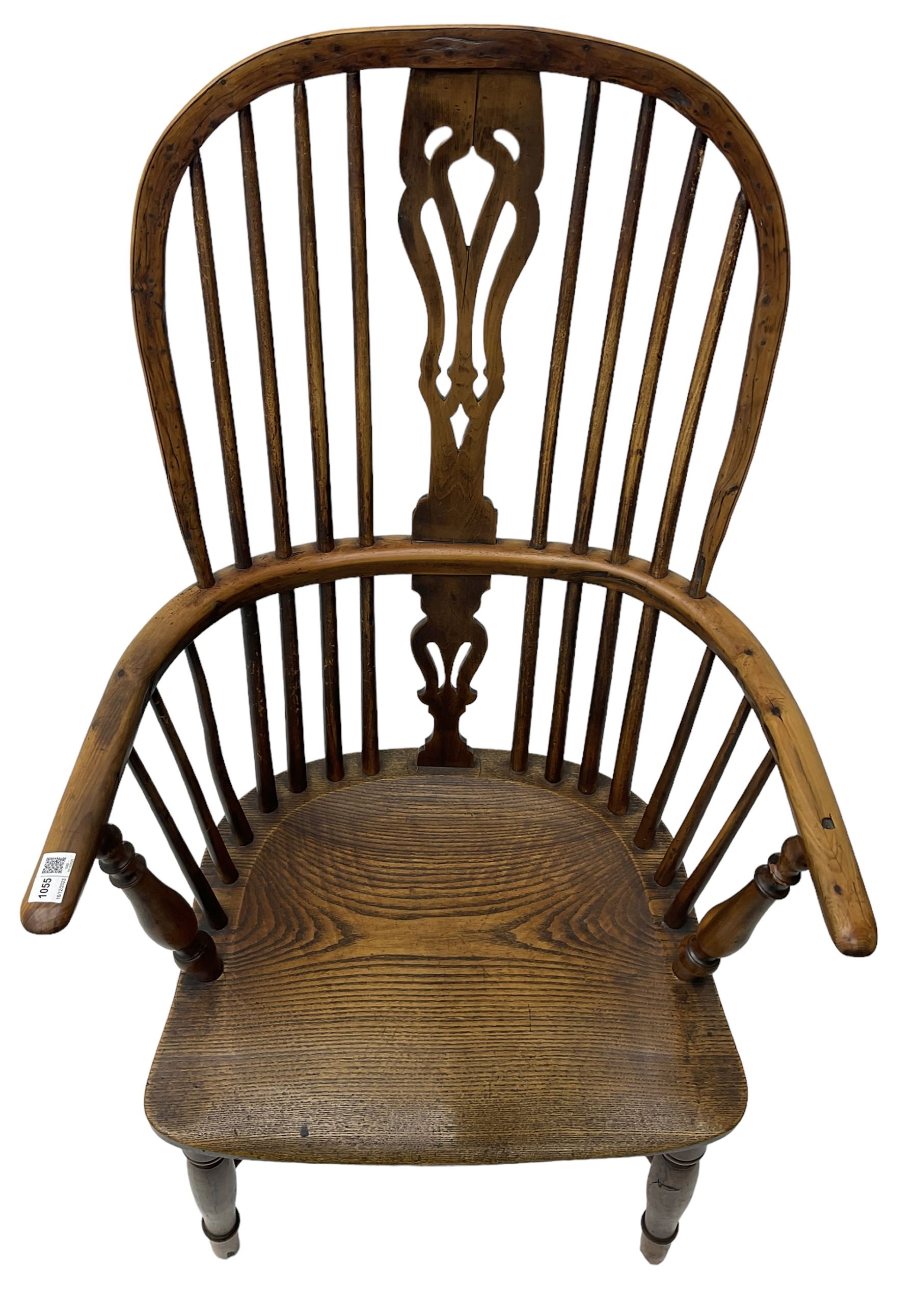 19th century yew wood and elm Windsor chair, high hoop and stick back with pierced splat over dished seat, raised on ring turned supports united by crinoline stretcher