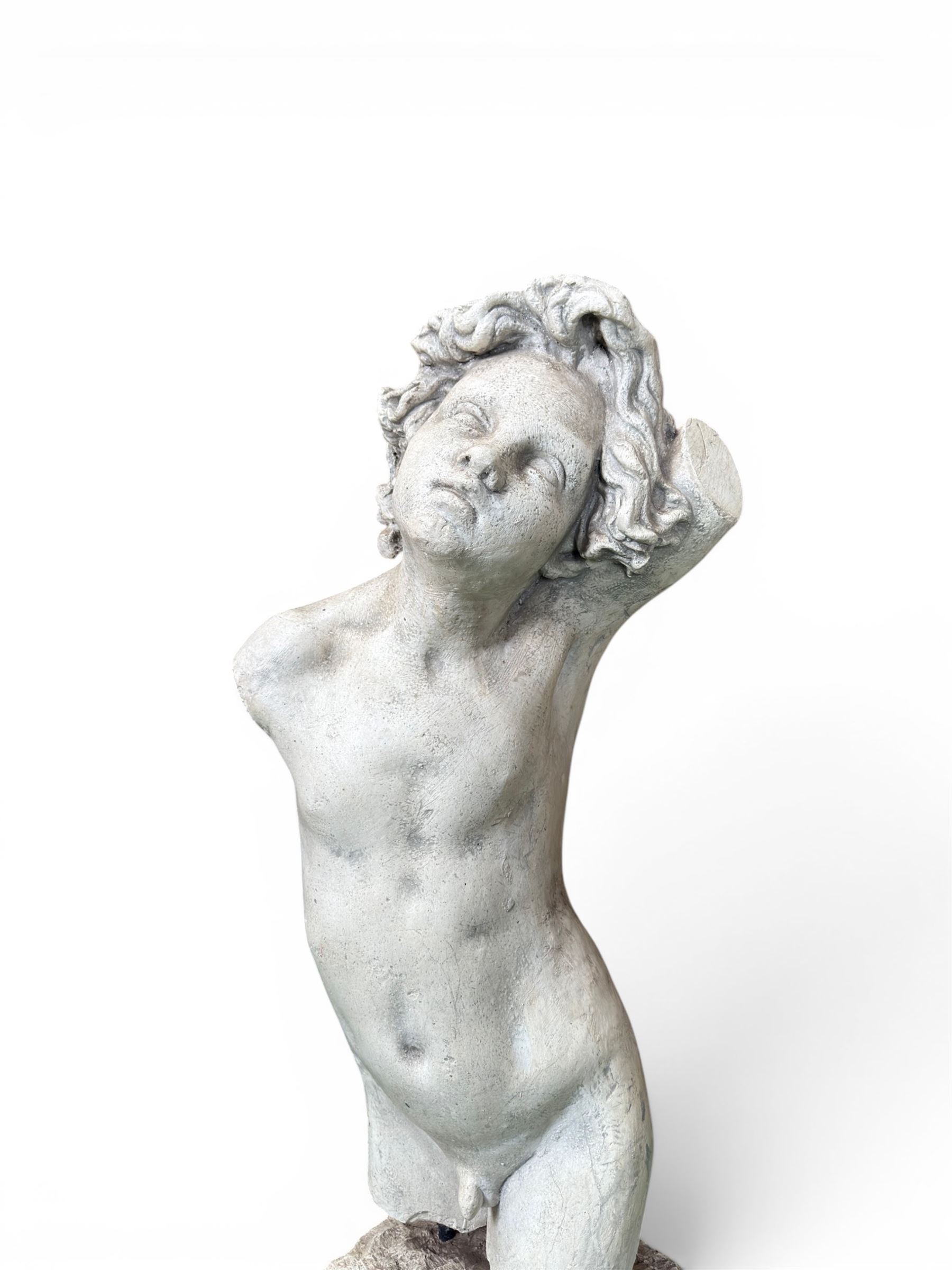 Early 20th century sculptured painted plaster figure of a boys torso, raised on 'stone' plinth