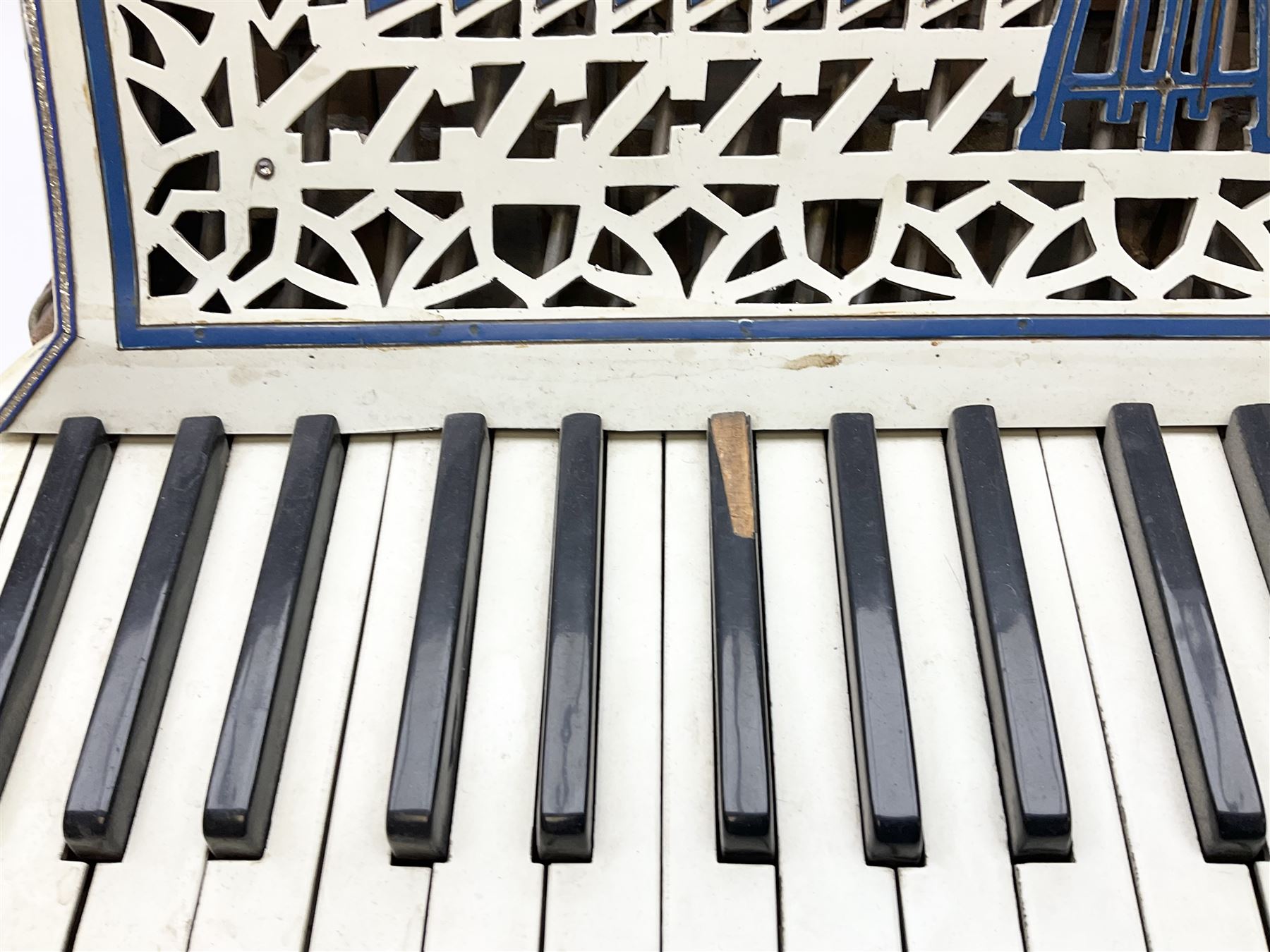 Italian Lambardi piano accordion in ivory coloured pearline case with jewelled decoration, twenty keys and one-hundred and twenty buttons L 37cm
