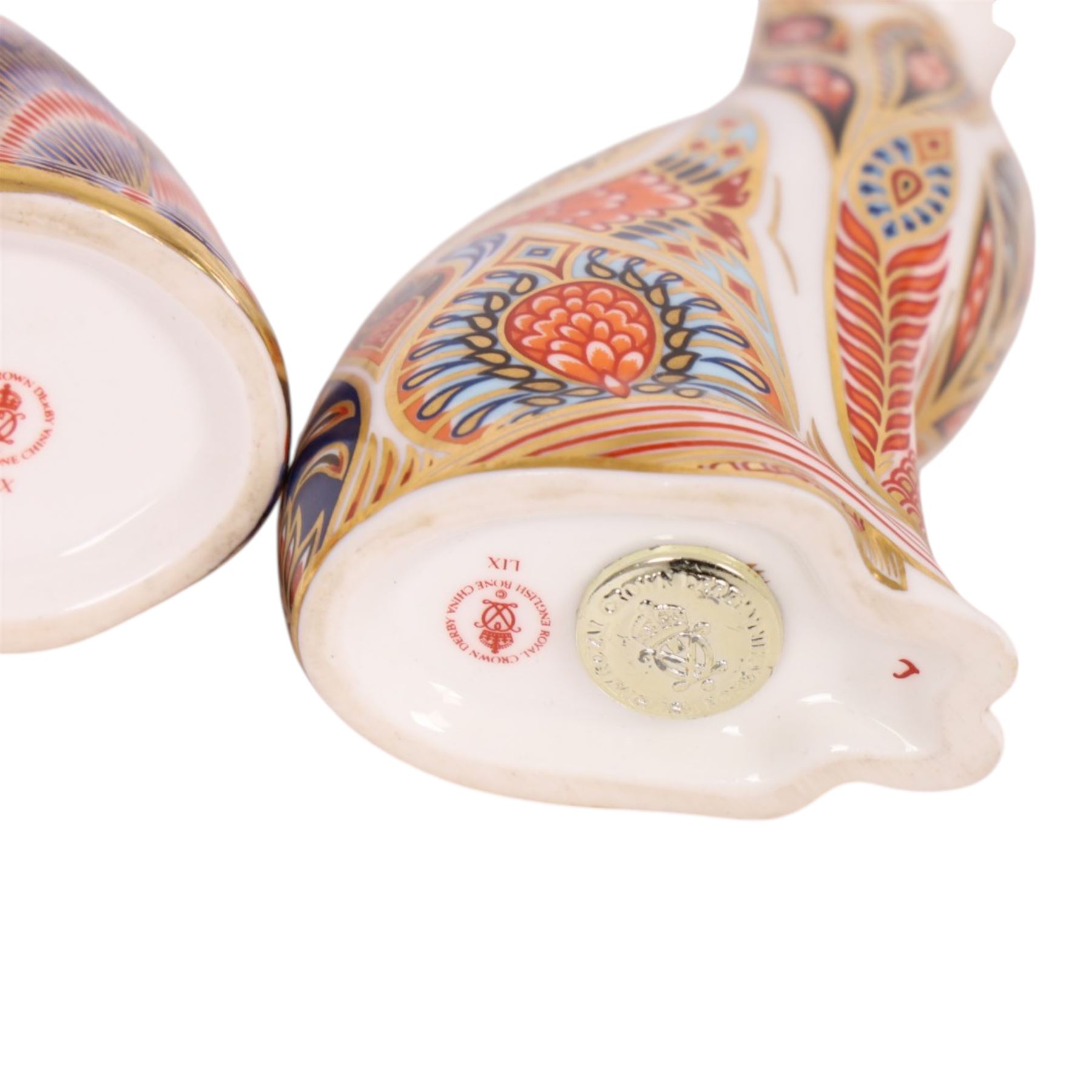 Three Royal Crown Derby paperweights, comprising Field Mouse gold stopper, Siamese cat gold stopper and seated cat gold stopper