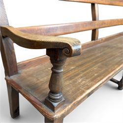 Early 20th century pine and oak bench seat, stained pine rail back frame with shaped oak arms