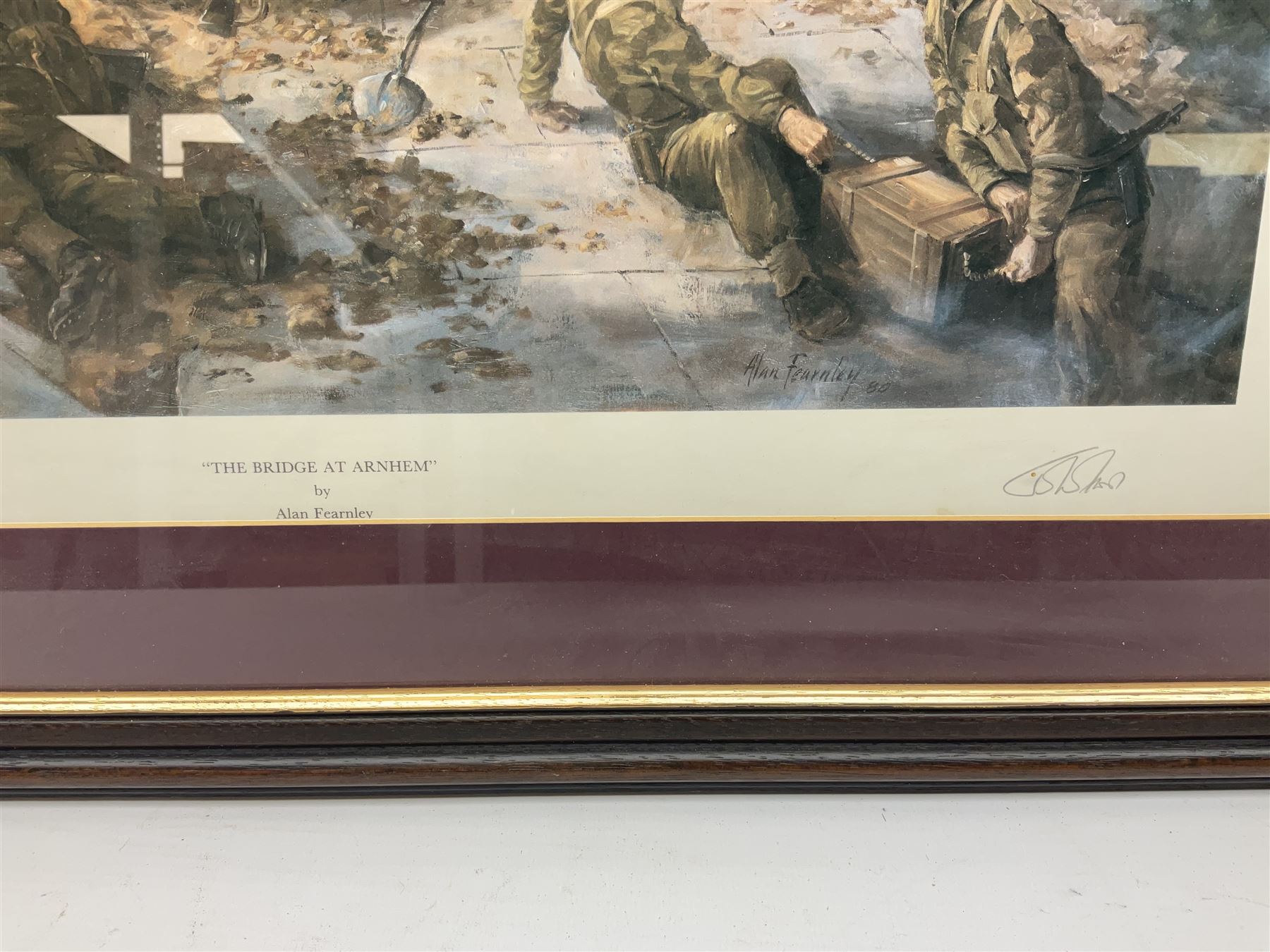 After Alan Fernley, colour print 'The Bridge at Arnhem', signed on the mount, 37 x 50cm; and after John Sellars, colour print 'Pegasus Bridge. Early Morning of D-Day 6th June 1944 Benouville Normandy'; both in mahogany stained frames (2)