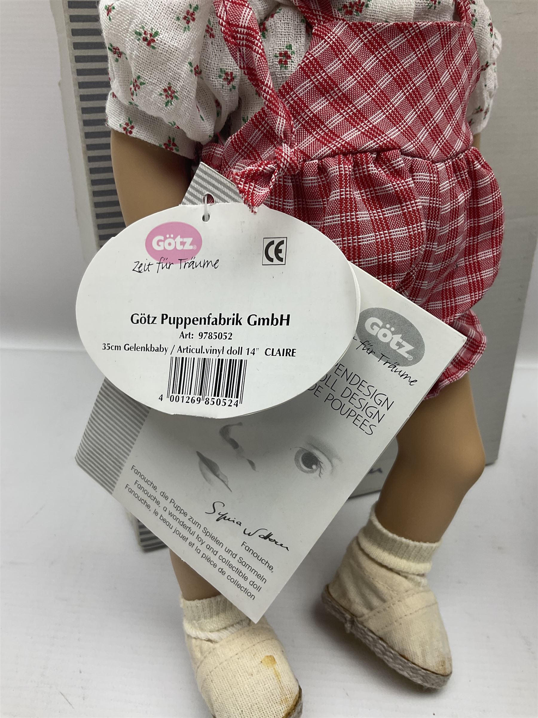 German Gotz articulated vinyl baby doll 'Claire' c1997 with original clothing, hat and labels; artist designed by Sylvia Natterer H35cm; boxed; and small child's wooden cased drum (2)