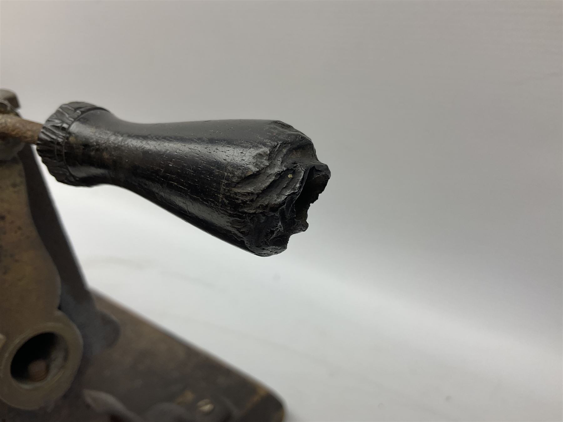 Victorian cuff and collar tabletop mangle, the ribbed brass rollers in a cast iron frame mounted on a wooden base