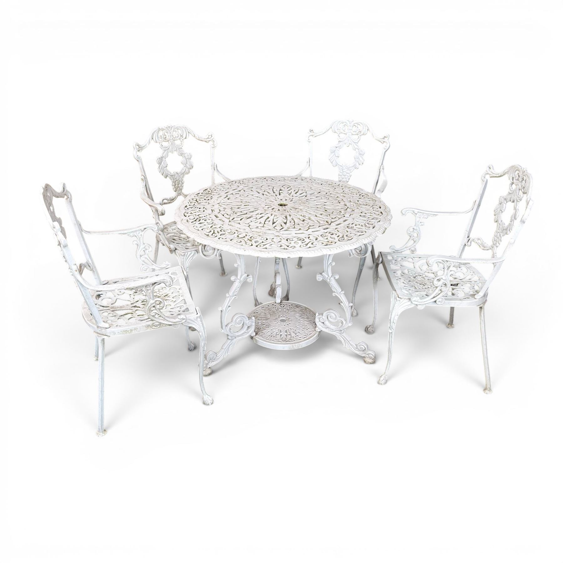 Victorian design cast aluminium circular garden table and four armchairs, ornate grape design in antique white paint