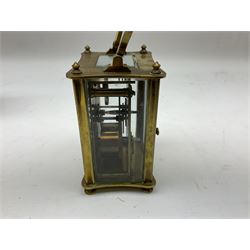 Early 20th century brass cased carriage clock retailed by Barnby & Rust Hull, with moulded columns, five bevelled glass panels, enamelled dial with Roman numerals and eight-day movement, in carrying case with viewing aperture H14cm including swing carrying handle  