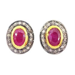 Pair of silver and silver-gilt oval cut ruby and diamond cluster stud earrings, stamped 925