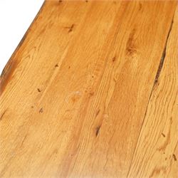 Late 20th century light oak extending refectory table, in the manner of Titchmarsh & Goodwin, rectangular plank top with cleated ends and two draw leaves extending to 260cm, supported on turned end supports united by a stretcher, raised on block feet