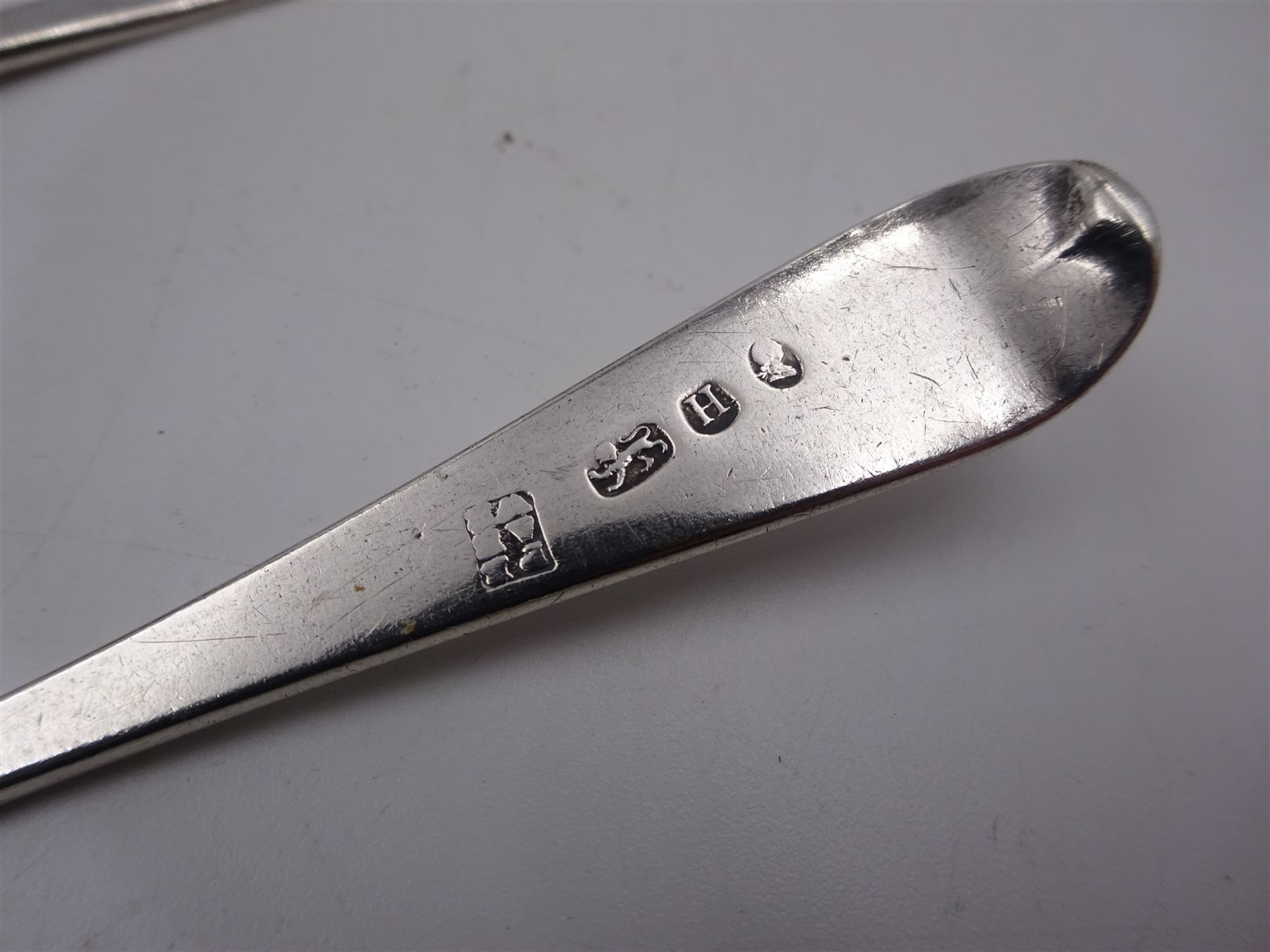 1920s silver cigarette case, of typical form, with engraved lozange to cover, hallmarked Charles Edwin Turner, Birmingham 1920, together with a pair of George III silver Old English pattern teaspoons, with engraved initials to terminal, hallmarked Peter, Ann & William Bateman, London 1803 and a cased spoon and pusher, hallmarked 