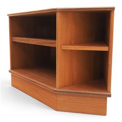 G-Plan - teak corner media unit, shaped top above a sliding central shelf above an open recess, flanked by further shelves, raised on a plinth base with a rear aperture for wires