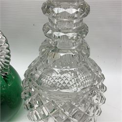 Pair of Victorian style cut glass decanters, each with silver collars, together with a Victorian green glass claret jug, with plaited clear glass handle and faceted stopper, tallest H26cm