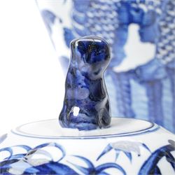 Pair of blue and white Chinese baluster vases and covers decorated with dragons, foliage etc H49cm