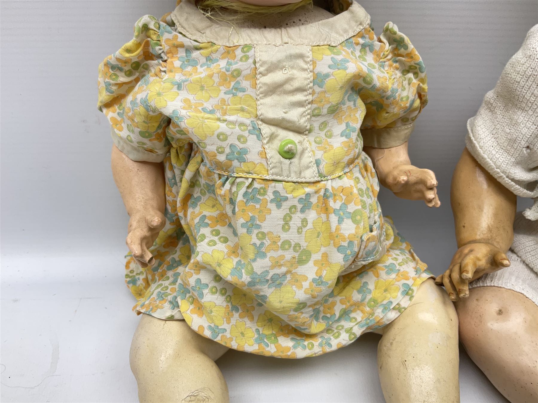 Carl Harmus Germany bisque head doll with applied hair, sleeping eyes, open mouth with teeth and composition body with jointed limbs; marked 'Harmus 313.4/0 Germany' H38cm; and Alt, Beck & Gottschalk Germany bisque head doll with applied hair, fixed eyes, open mouth with tongue and composition body with jointed limbs H44cm (2)