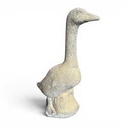 Large cast stone garden statue modelled as a standing goose on a naturalistic base