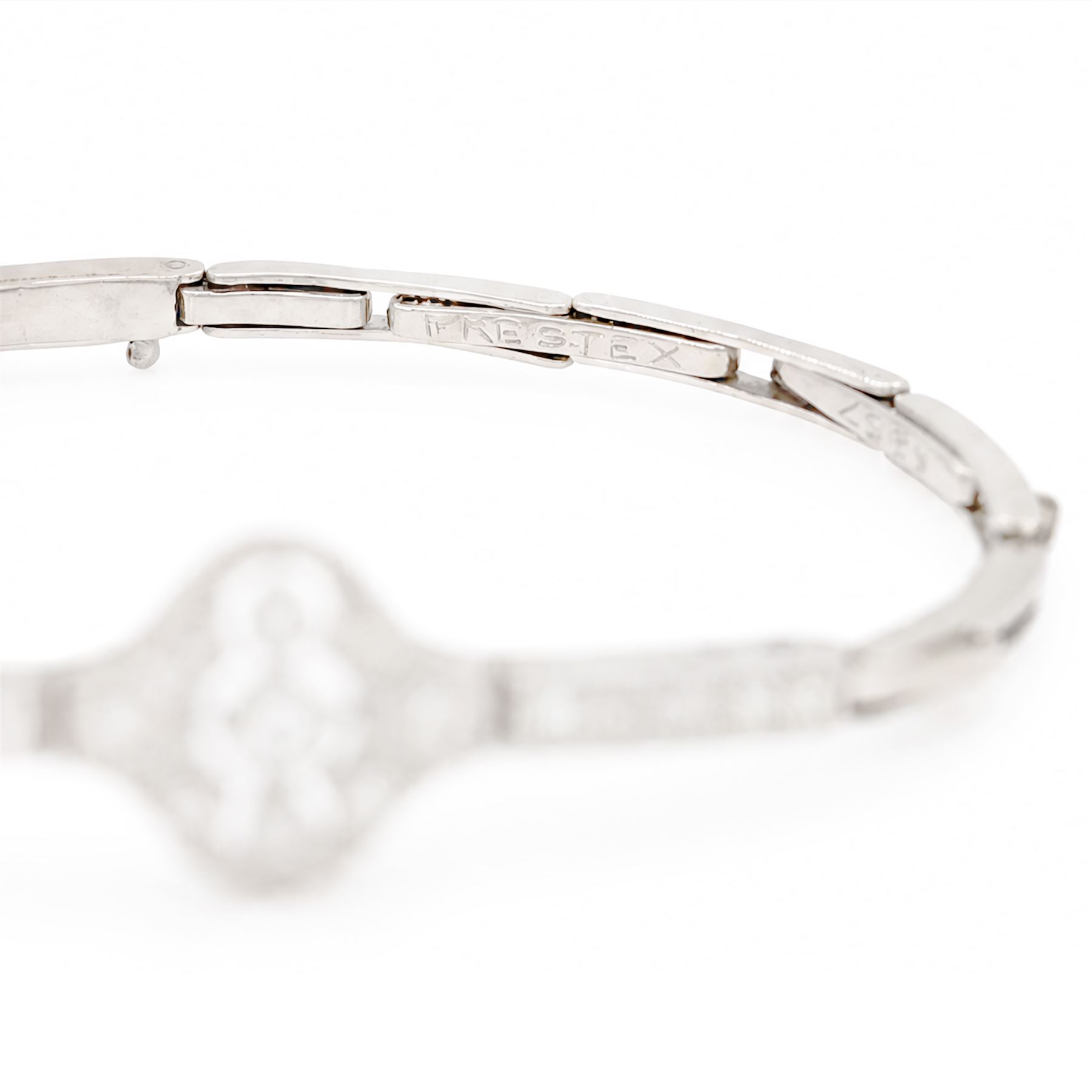 Art Deco white gold and platinum diamond bracelet, the central articulated panel milgrain set with old and single cut diamonds, to a white gold expanding link bracelet, stamped 18ct