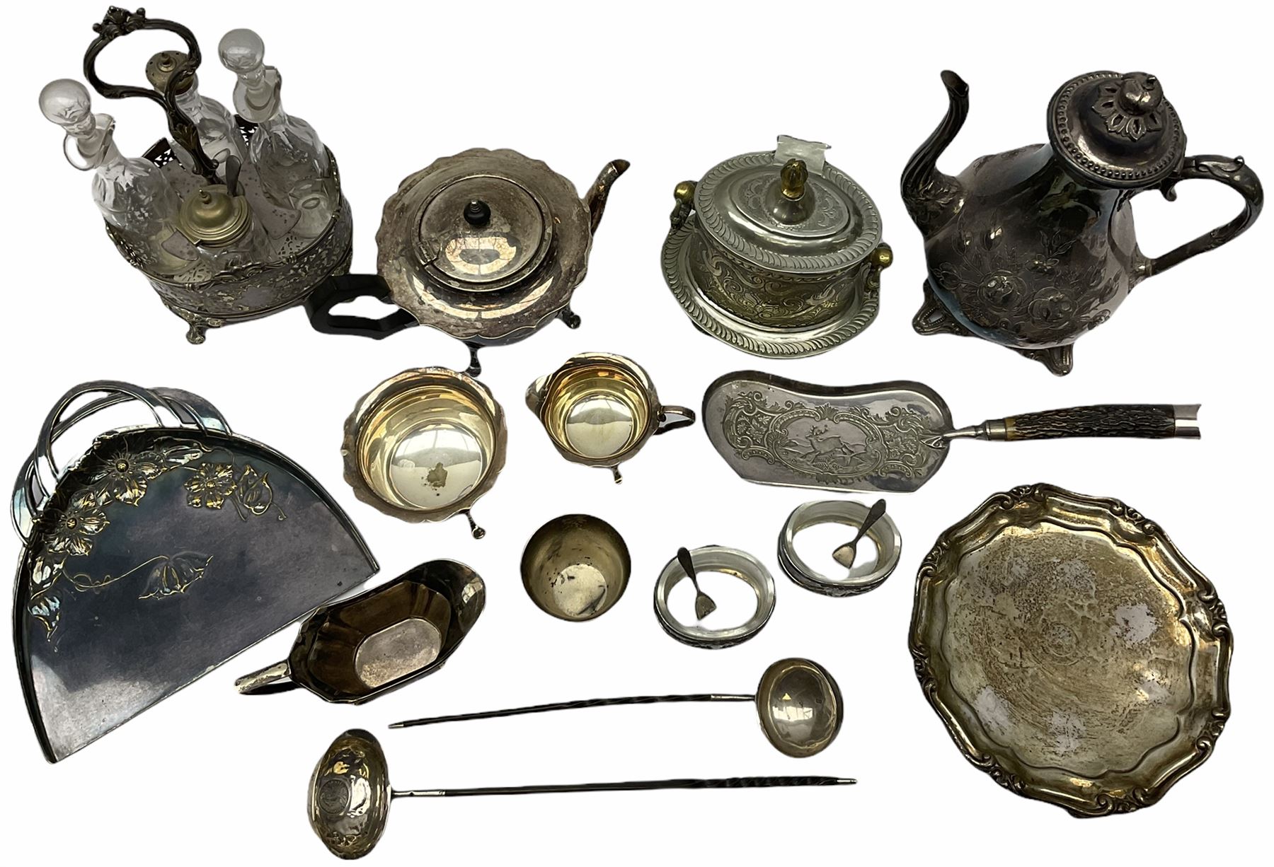 Two Georgian silver toddy ladles with baleen twist handles, (neither hallmarked), one with inset coin to bowl, together with a group of silver plate including cruet stand enclosing two glass bottles with stoppers, shaker and preserve pot with spoon, pair open salts with glass liners, etc. 