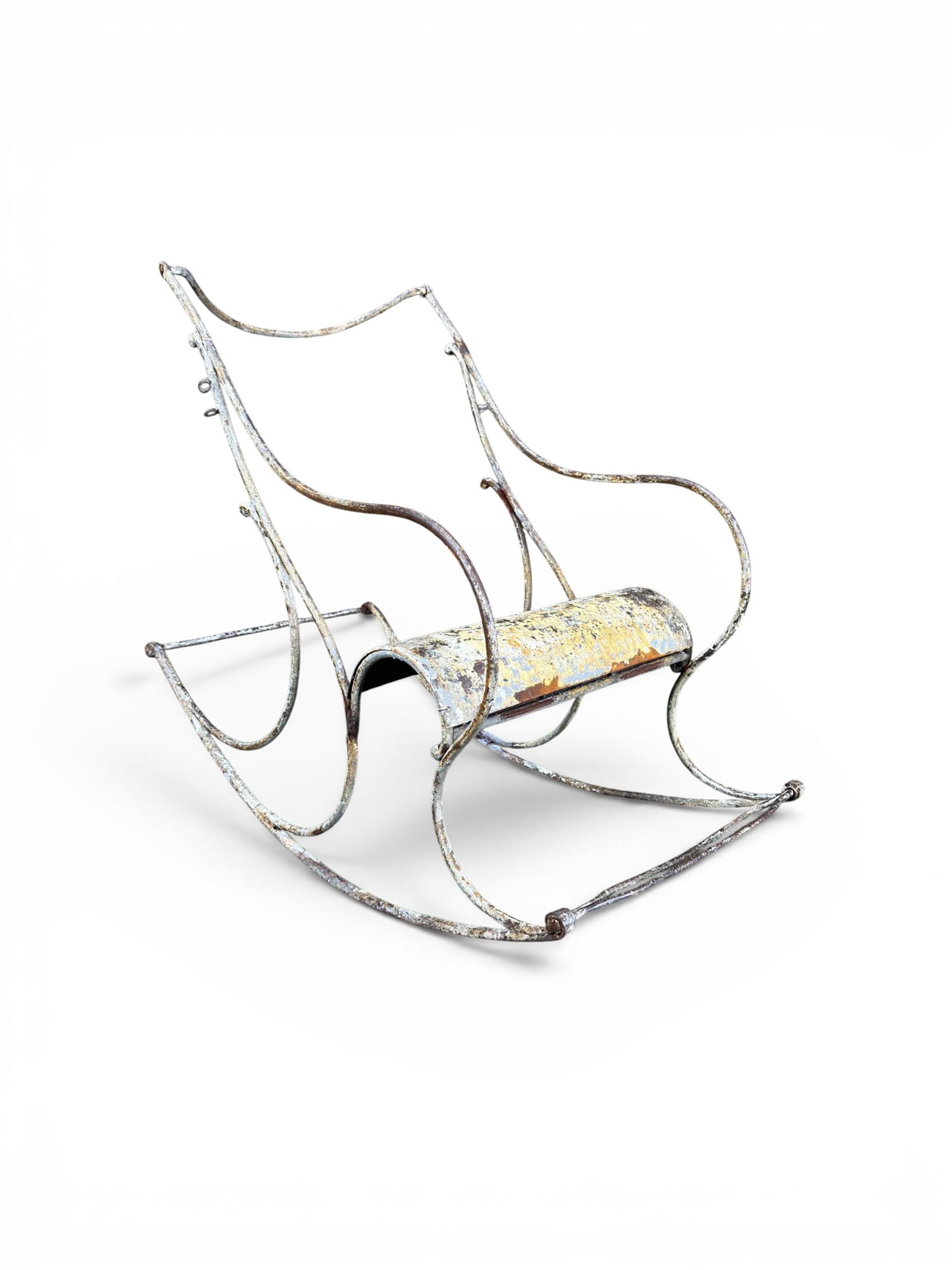 Pair of large unusual 19th century wrought iron garden rocking chairs, simple scroll design, lacking canvas seat