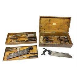 Naval doctor's surgical instruments, contained in a converted brass bound oak pistol box, the hinged lid opening to reveal two removable fitted trays, containing 19th century and later saws, scalpels, tweezers etc