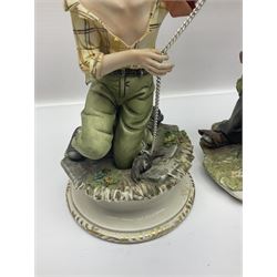 Three Capodimonte figures, to include The Kind Heart Man, modelled by Cortese as a tramp with two doves, The Young Falconer by Maria Angela and another modelled as a tramp darning his socks, all with printed marks, tallest H39cm