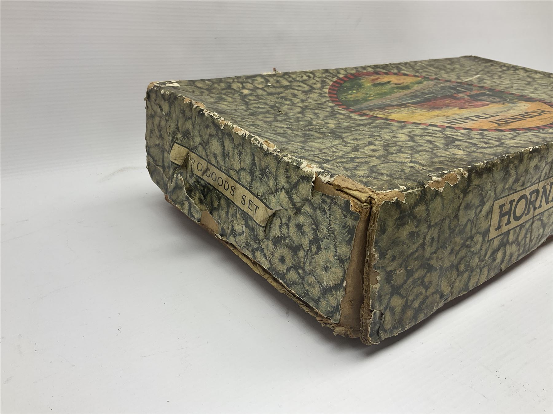 Hornby ‘0’ gauge - No. 0 Goods Set box containing clockwork LNER 0-4-0 locomotive with matching tender no.2710 in black and gold, originally from the No. 1 Goods Set; with NE open wagon, quantity of track, track clips, buffer and key 